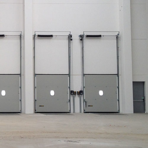 Porta industrial seccionada - VERTICAL LINTEL - KOPRON - metálica / automática / com isolamento térmico