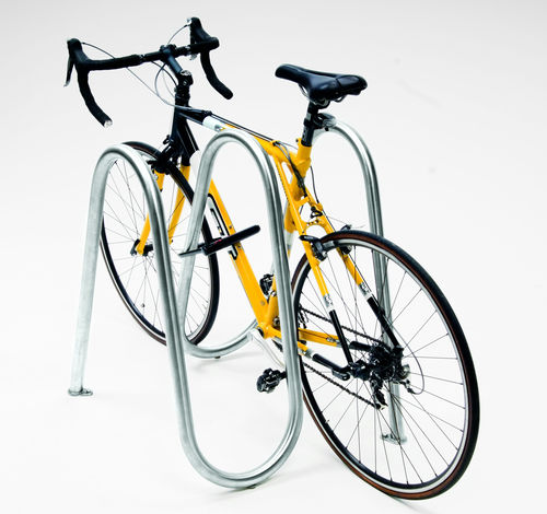 Bicicletário de piso - LANDMARK : FLO - landscapeforms - para espaço público / em aço inoxidável / da linha comercial