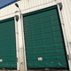 porta industrial seccionada / em aço inoxidável / alta / resistente à corrosão