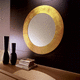 espelho de parede / contemporâneo / redondo / dourado