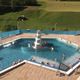 piscina com transbordo / sob medida / para ambiente externo / para ambiente interno