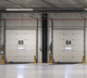 porta industrial seccionada / de aço / com isolamento térmico / automática